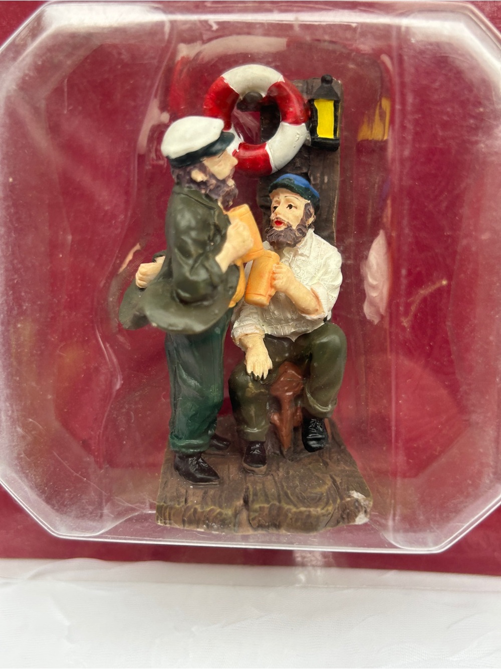 Christmas village chatting sailors